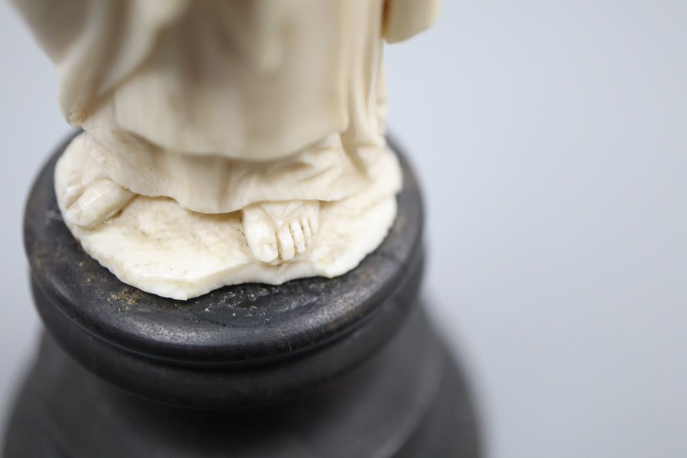 An ivory depiction of the Pope on wooden base, height 17cm
